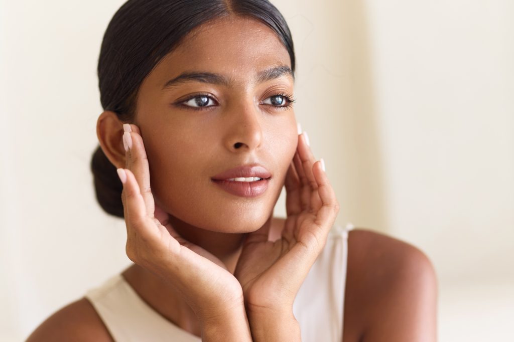 Elegant Woman Posing with Natural Beauty and Radiant Skin