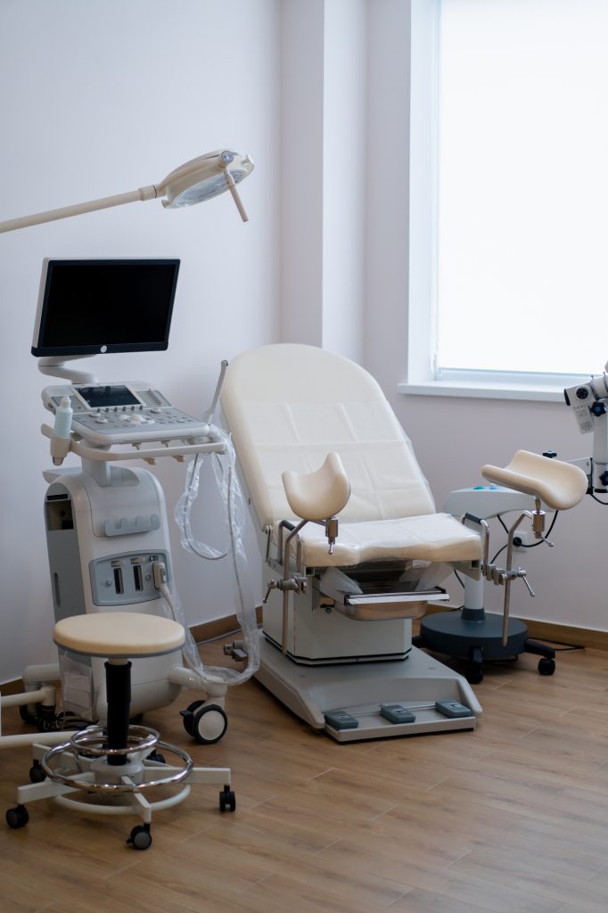 Medical office with ultrasound diagnostic equipment in the clinic gynecological chair