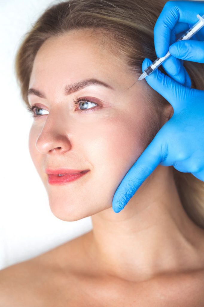 Rejuvenating facial injections procedure for tightening and smoothing wrinkles on the face skin