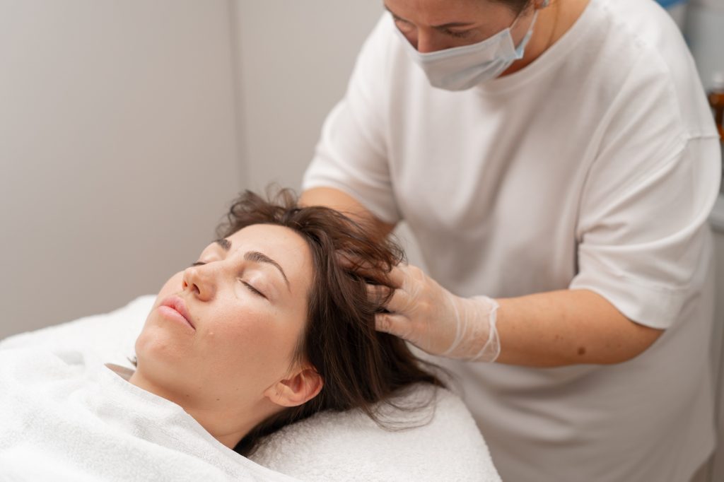 beautician makes injections into the scalp hair growth Mesotherapy for hair growth