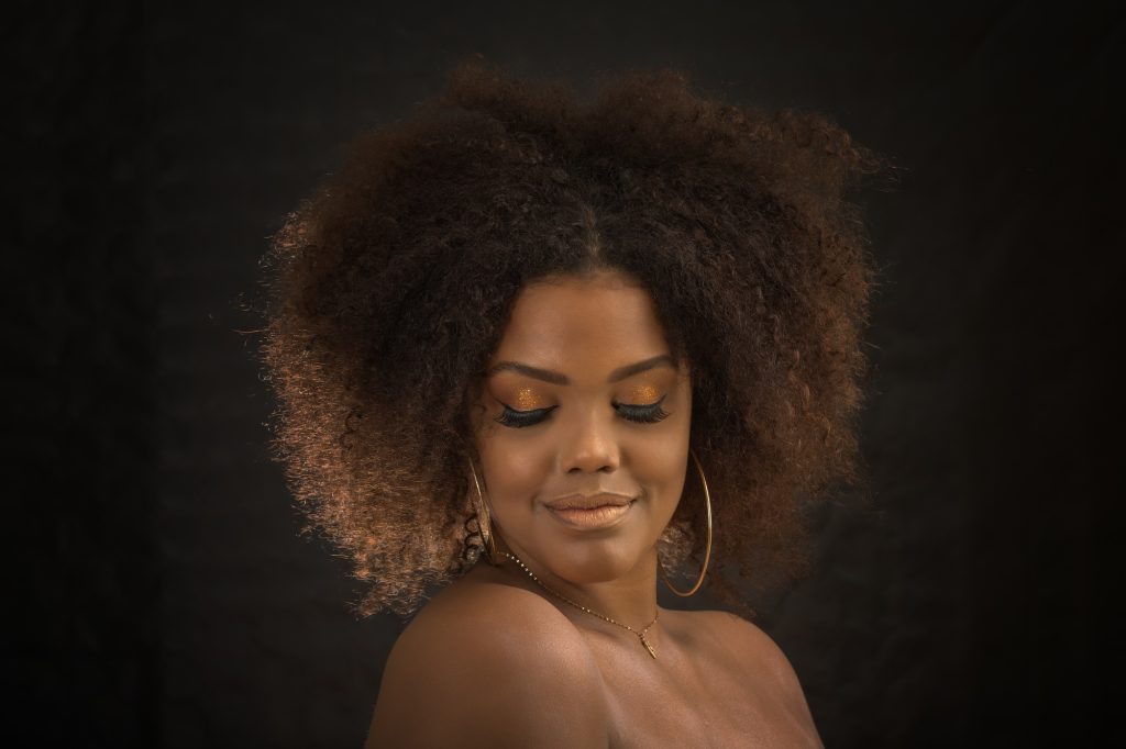 Gorgeous black model with makeup and hairstyle